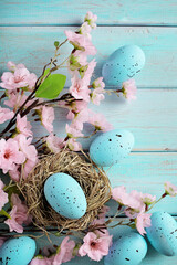 greeting card with colorful easter eggs and spring flowers.