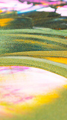 Fototapeta premium Abstract glitter paints texture on canvas. Background with glittering paints. Macro close up of different color oil paint