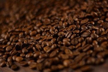 Roasted coffee beans on a wooden table