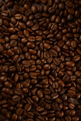 Roasted coffee beans on a wooden table