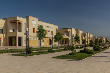 Fototapeta na wymiar Modern houses and a park in Shahrisabz, Uzbekistan