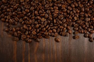 Roasted coffee beans on a wooden table