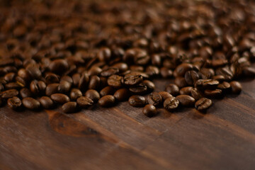 Roasted coffee beans on a wooden table