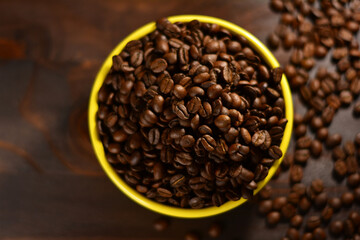 Roasted coffee beans on a wooden table