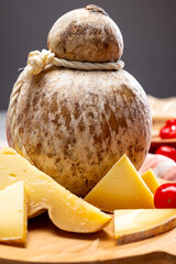 Italian semi hard matured caciocavallo cheese, handmade and aged in natural underground caves in...
