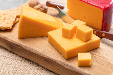 Red waxed yellow cheddar cheese close up
