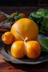 Cheese collection, Italian cheeses provolone, caciocavallo, scamorza made from sheep or cow milk in South Italy, white and yellow smoked.