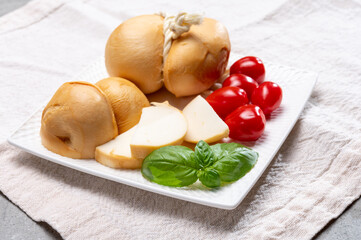 Italian semi hard handmade smoked scamorza cheese, from cow milk from Apulia or Calabria regions