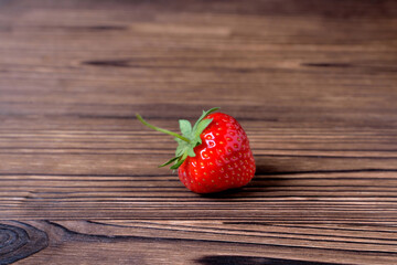 Strawberries on a natural wooden background close-up