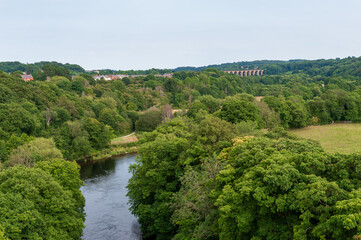 Fototapeta na wymiar Traphont Cefn Mawr Rail Viaduct across the River Dee in the Vale of Llangollen in northeast Wales. As seen from the Pontcysyllte Aqueduct. Built in 1848. Great Britain.