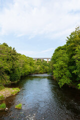 Fototapeta na wymiar Pontcysyllte Aqueduct, carries the Llangollen Canal waters across the River Dee in the Vale of Llangollen in Wales. 18-arched stone and cast iron structure is for use by narrow, canal-boats. UK