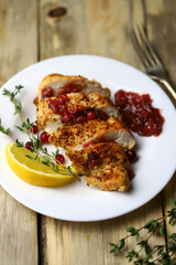 Turkey fillet with cranberry sauce presented on a plate. Christmas dinner. Healthly food.