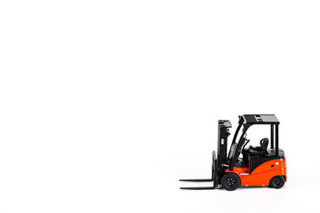 Red toy forklift loader isolated on white background. Copy Space for text. moving service and distribution products. Delivery production. Logistics and industrial concept.