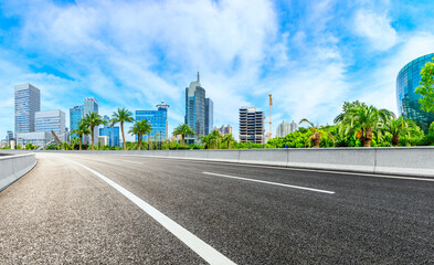 Empty asphalt road and Shanghai skyline with buildings scenery.