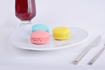 colorful macaroon dessert and wine