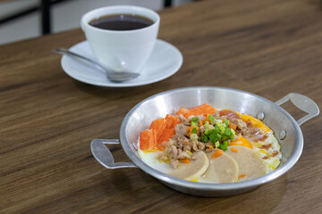 Closeup of pan fried eggs, minced pork, crab stick