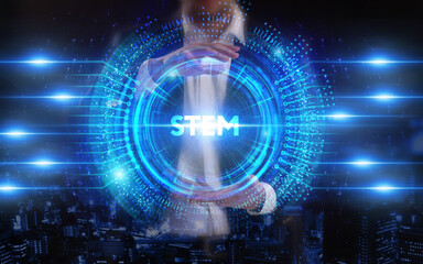 Fototapeta premium Business, Technology, Internet and network concept. Young businessman working on a virtual screen of the future and sees the inscription: STEM