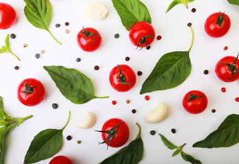 Tomato, basil, spices, pepper, garlic. Vegan diet food, creative cherry tomato composition isolated on white.