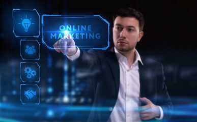 Business, Technology, Internet and network concept. Young businessman working on a virtual screen of the future and sees the inscription: Online marketing