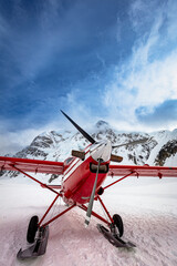 Red bi-plane on Denali © Dennis