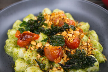 pesto gnocchi with cherry tomatoes 
