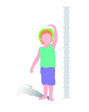 A child is measuring his height and gesturing with one hand over his head