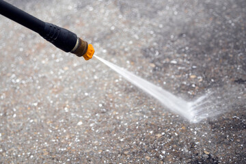 Pressure washing a concrete surface 