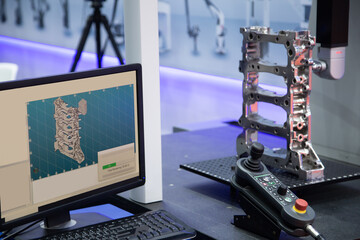 CMM Coordinate Measuring Dimension Machine inspecting engine part. Automotive industry