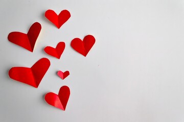 festive valentine's day background. Red hearts on a white background. Place for your text