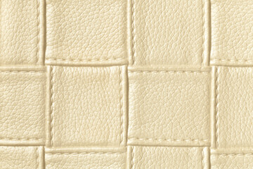 Fototapeta premium Texture of golden and cream leather background with square pattern and stitch.