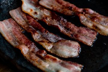 Bacon rashers frying