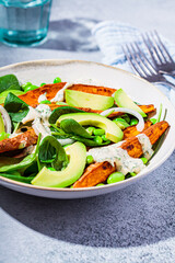 Vegan food concept. Baked sweet potato salad with avocado and edamame.