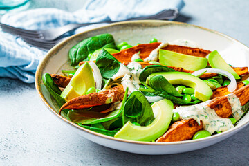 Vegan food concept. Baked sweet potato salad with avocado and edamame.