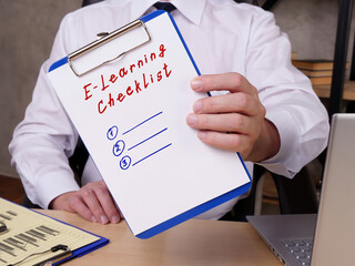  Financial concept about E-Learning Checklist with sign on the piece of paper.