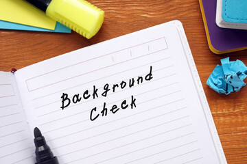 Financial concept meaning Background Check with inscription on the piece of paper.