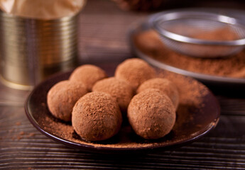 homemade chocolate balls truffles on the plate.