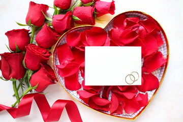 Happy Valentine's Day greeting card. beautiful bouquet of flowers and heart shaped gift box and a wedding ring