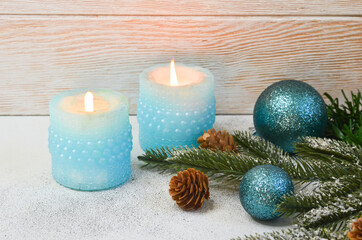 Christmas background or greeting card sparkling fir-tree branches with toys and cones with space for text