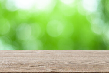 Wooden decking with space for placement of advertising materials. And has a blurred background, bokeh, can be used as a background advertising