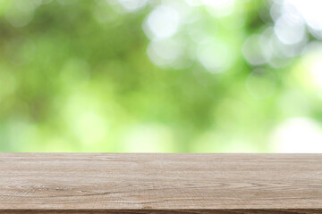 Wooden decking with space for placement of advertising materials. And has a blurred background, bokeh, can be used as a background advertising