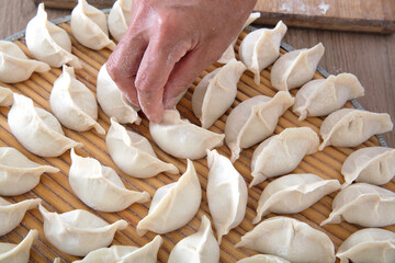 Put the wrapped dumplings neatly on the circular tray