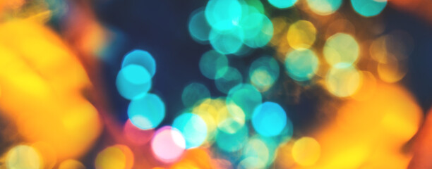 Colorful background with natural bokeh texture and defocused sparkling lights. Teal and orange blur...