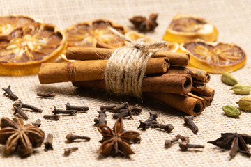 cinnamon sticks and anise, star anise and orange. close-up