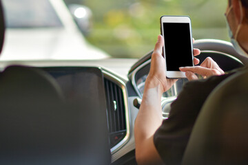 Man using mobile phone in car