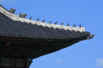 Fototapeta na wymiar The shamanistic figure of a goblin, dragon, pig, monkey, etc. installed on the roof to prevent death or fire in a palace during the Joseon Dynasty.