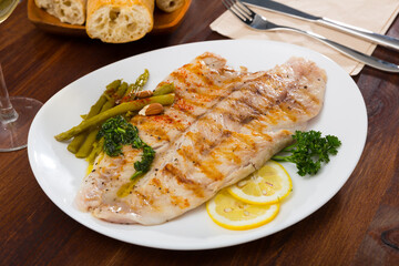 Healthy dinner, oven baked perch fish with vegetables and nuts
