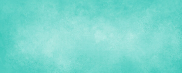 Light blue green background paper with soft grunge border texture in spring and Easter colors