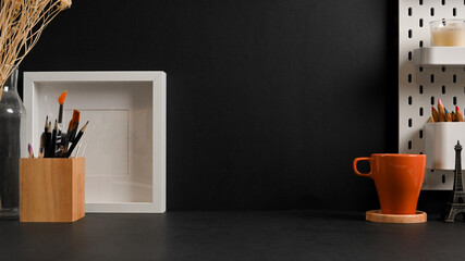 Workspace with stationery, mock up frame, mug and copy space in home office room