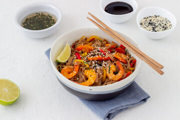Noodles with shrimps, pepper and soy sauce. Asian food. Wok.