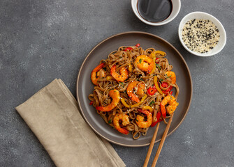 Noodles with shrimps, pepper and soy sauce. Asian food. Wok.